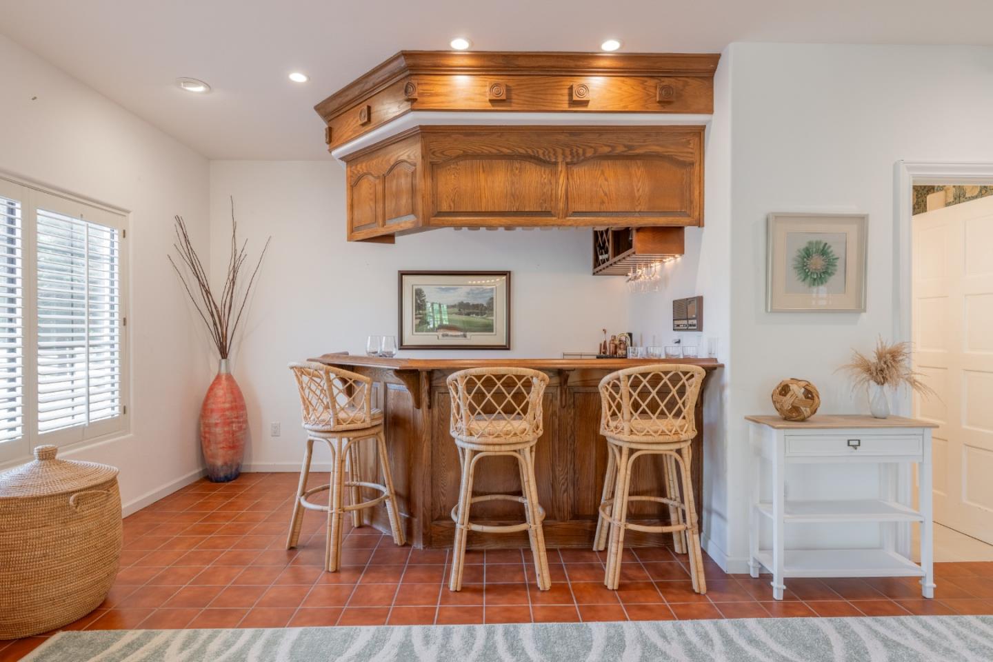 1043 Broncho Road Pebble Beach, CA 93953 - Photo 10 of 21 a dining room with furniture and wooden floor