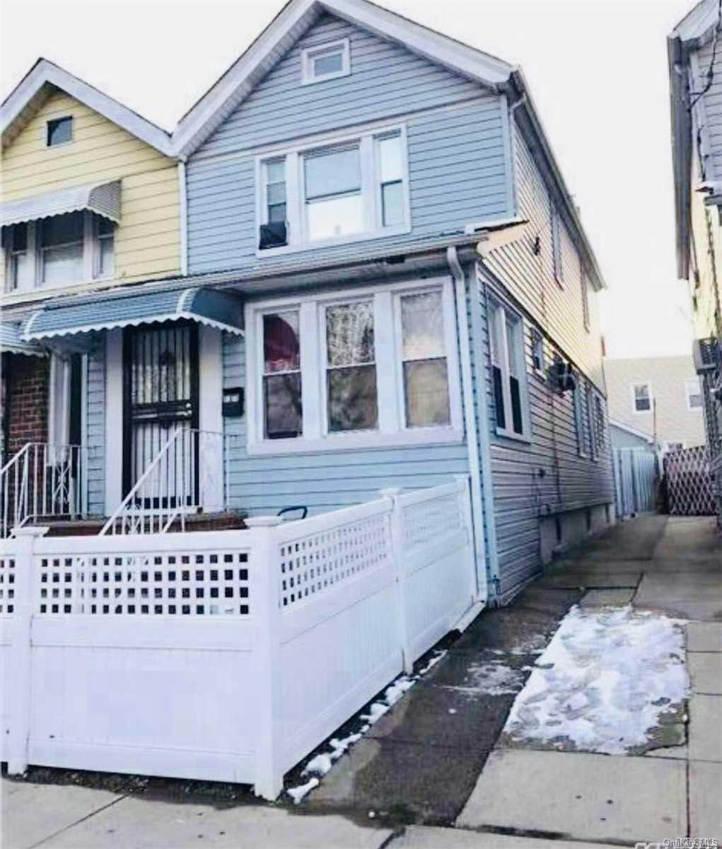 91-58 84th Street Queens, NY 11421 - Photo 1 of 1 a view of a house with a door