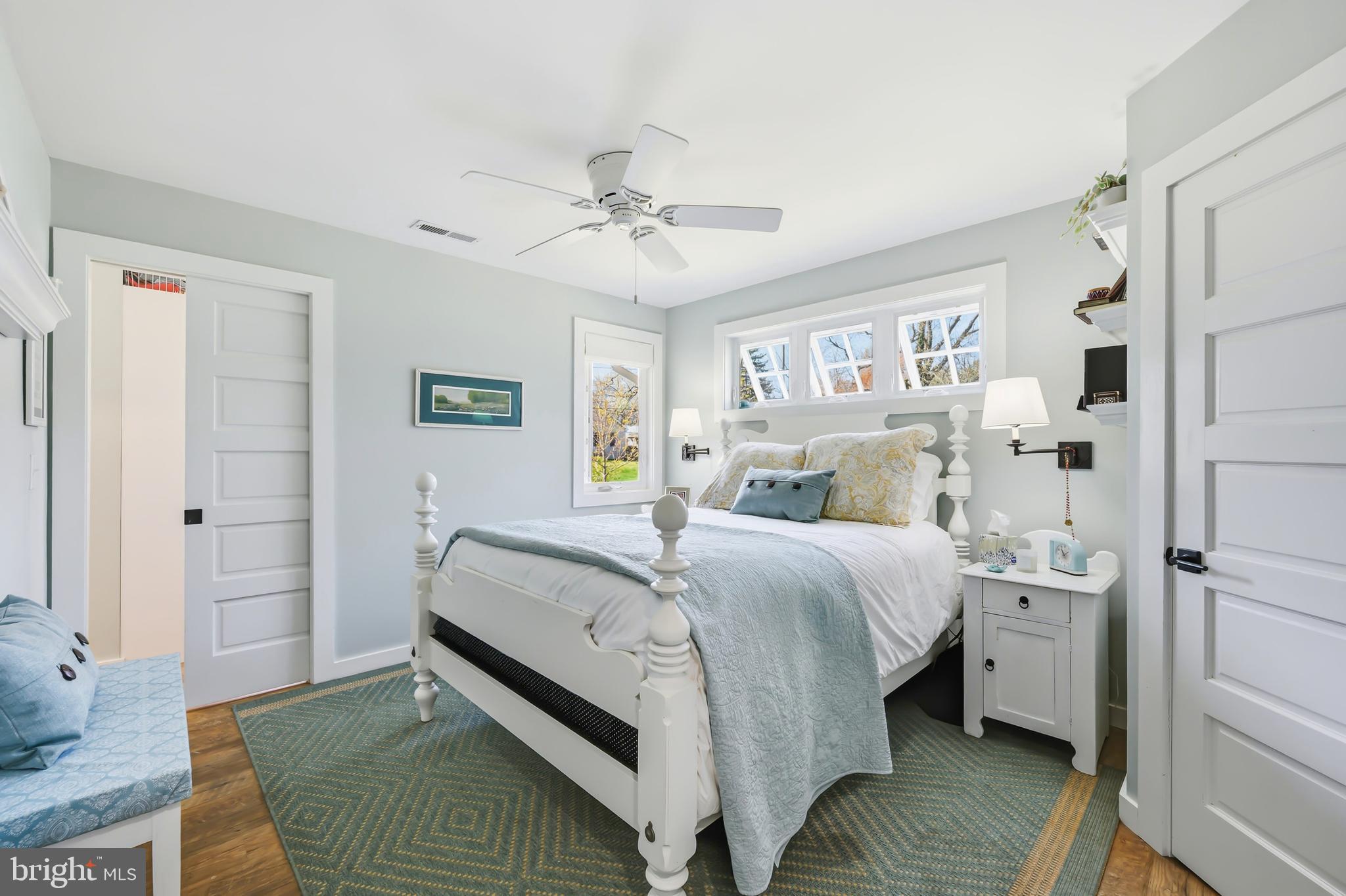 28567 Holden Road Easton, MD 21601 - Photo 36 of 45 a bed room with a bed and a chandelier