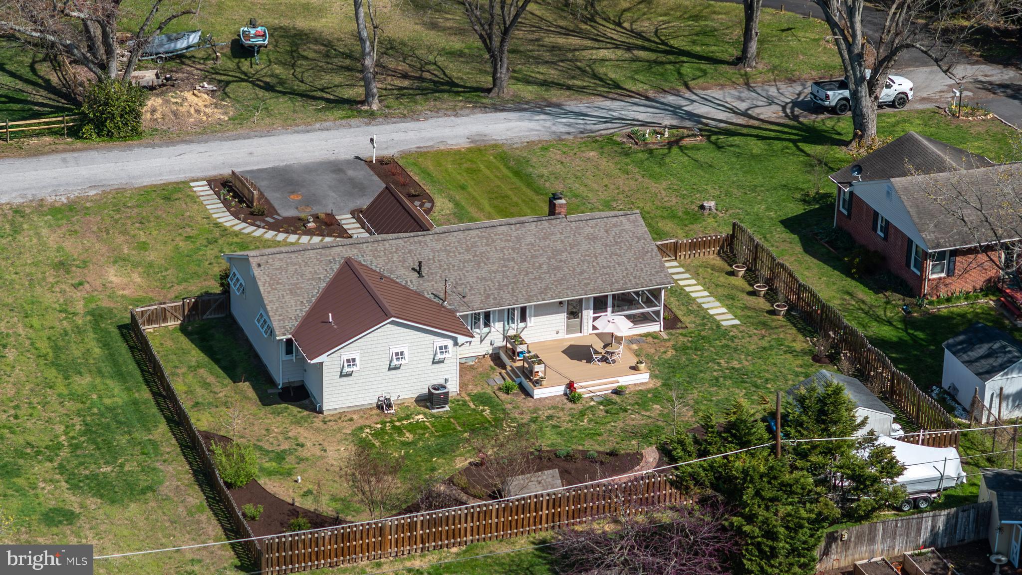 28567 Holden Road Easton, MD 21601 - Photo 10 of 45 an aerial view of a house with swimming pool and a yard
