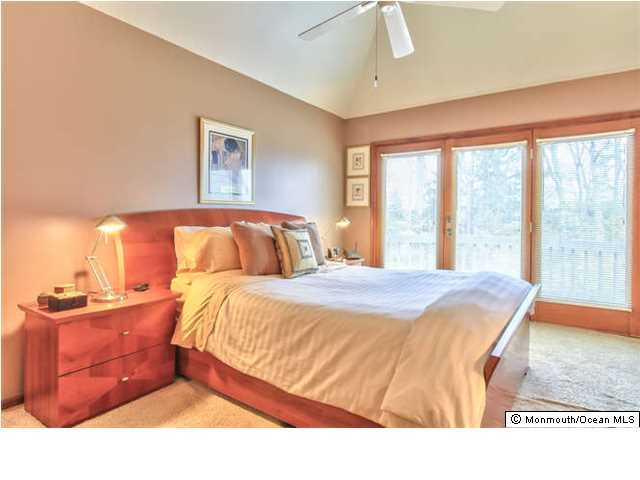 2403 River Road Point Pleasant, NJ 08742 - Photo 12 of 25 a bedroom with a bed and window