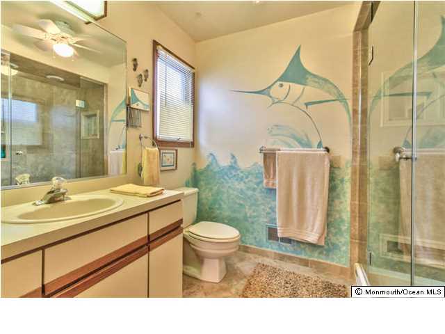 2403 River Road Point Pleasant, NJ 08742 - Photo 13 of 25 a bathroom with a sink toilet and shower