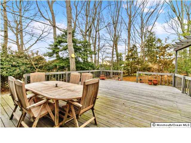 2403 River Road Point Pleasant, NJ 08742 - Photo 20 of 25 a view of a dinning table and chairs on the deck