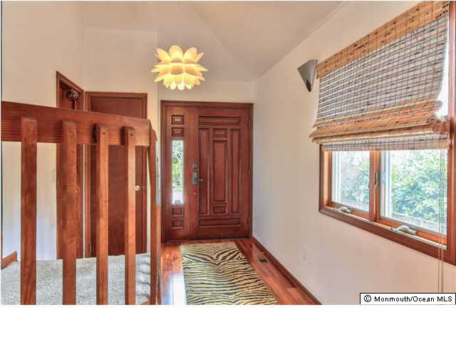 2403 River Road Point Pleasant, NJ 08742 - Photo 4 of 25 a view of an entryway with a chandelier