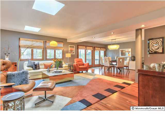 2403 River Road Point Pleasant, NJ 08742 - Photo 5 of 25 a living room with furniture a rug and a view of kitchen