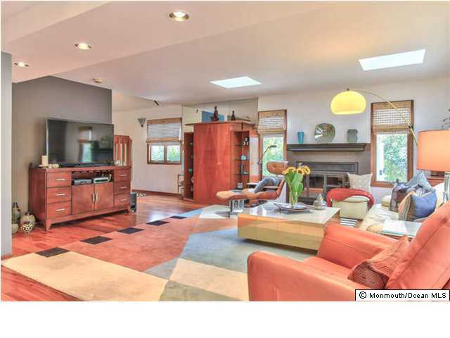 2403 River Road Point Pleasant, NJ 08742 - Photo 6 of 25 a living room with furniture and a fireplace