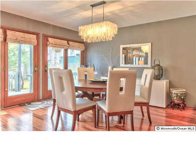 2403 River Road Point Pleasant, NJ 08742 - Photo 7 of 25 a view of a dining room with furniture and chandelier