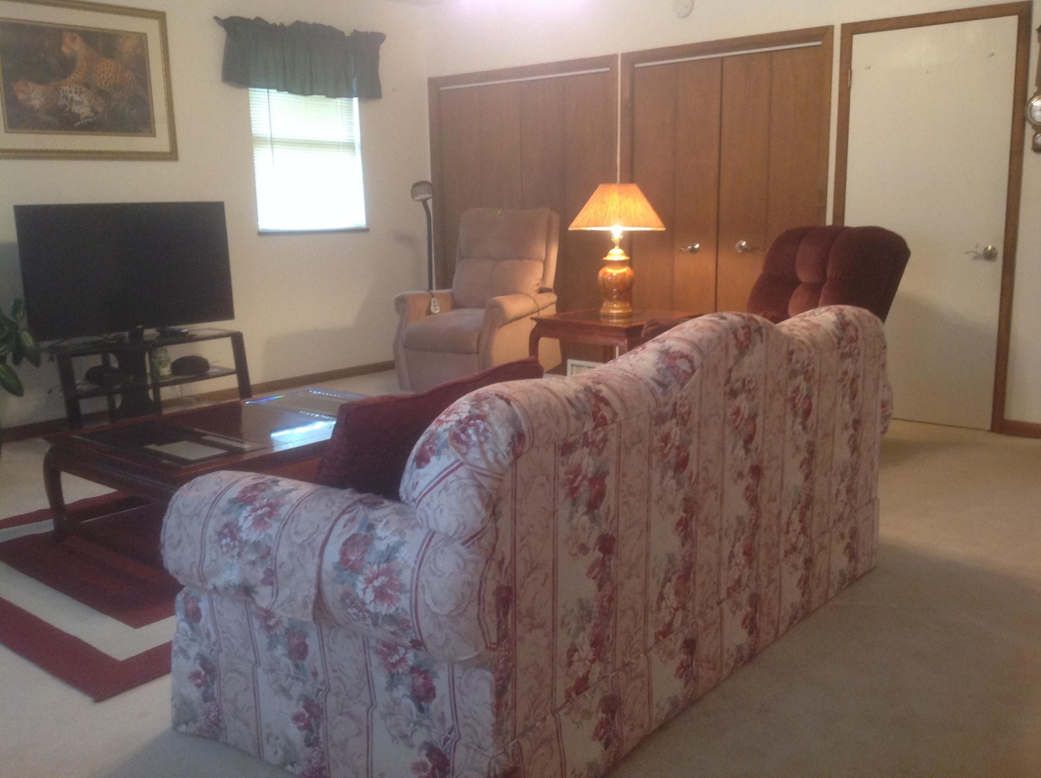 703 Deep Draw Road Crossville, TN 38555 - Photo 17 of 40 a living room with furniture a lamp and a flat screen tv