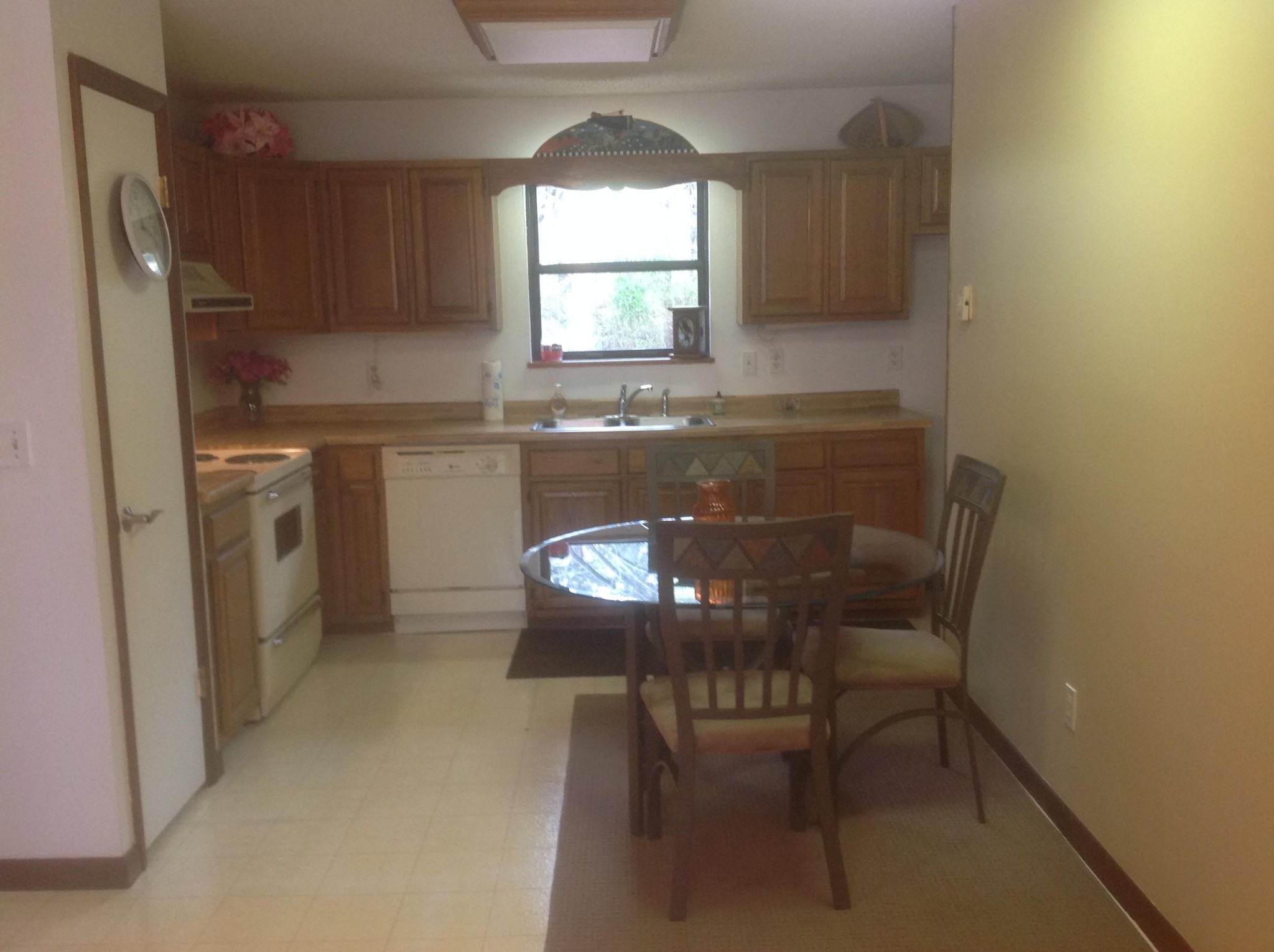 703 Deep Draw Road Crossville, TN 38555 - Photo 20 of 40 a kitchen with a dining table chairs and a refrigerator