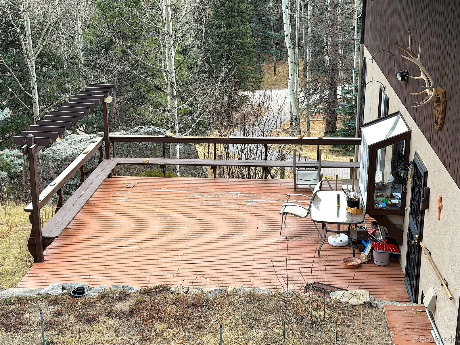 2508 Witter Gulch Road Evergreen, CO 80439 - Photo 18 of 47 a view of balcony with furniture