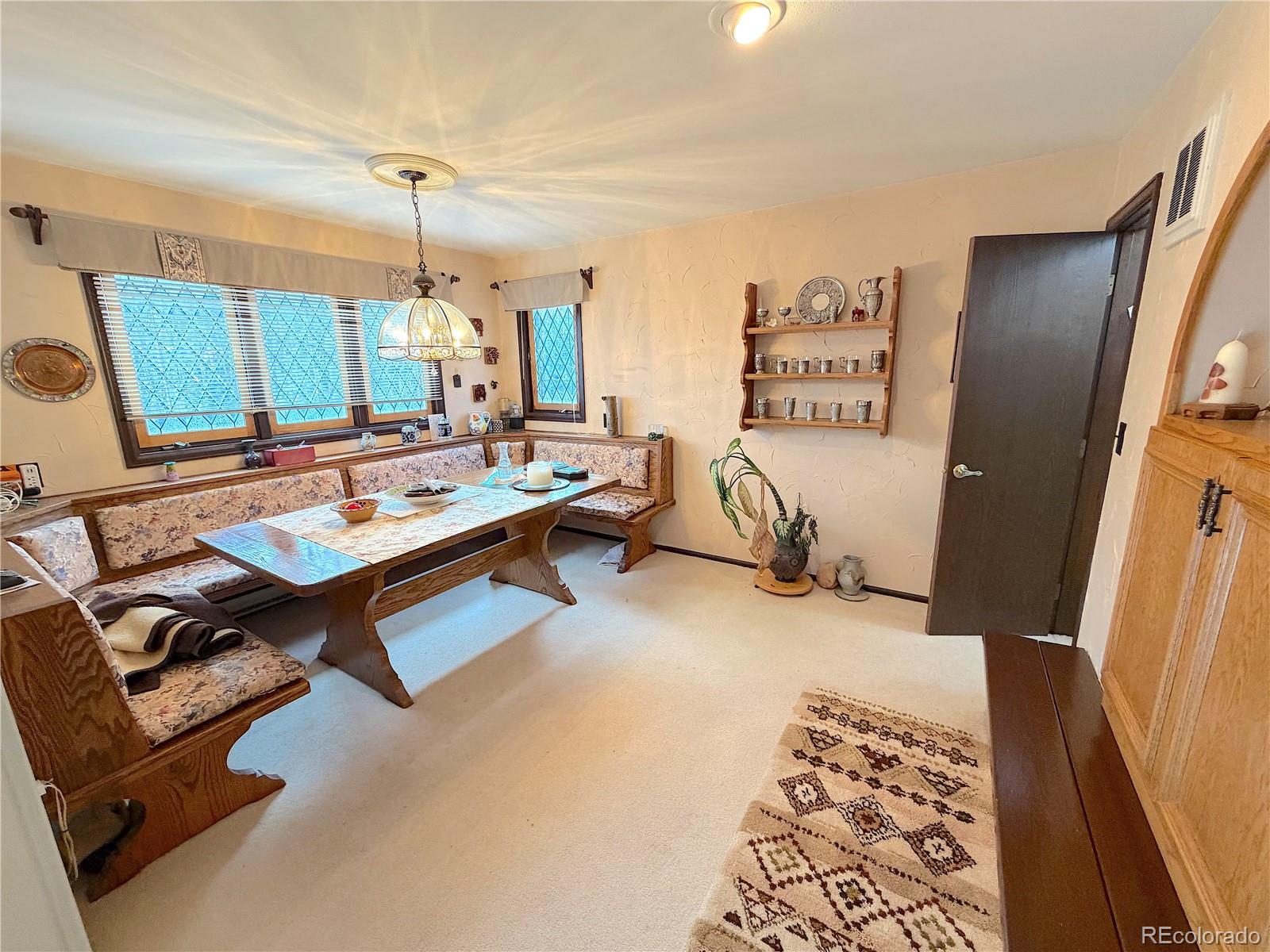 2508 Witter Gulch Road Evergreen, CO 80439 - Photo 24 of 47 a living room with furniture