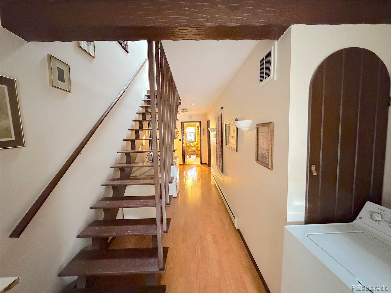 2508 Witter Gulch Road Evergreen, CO 80439 - Photo 33 of 47 a view of entryway and hall with wooden floor