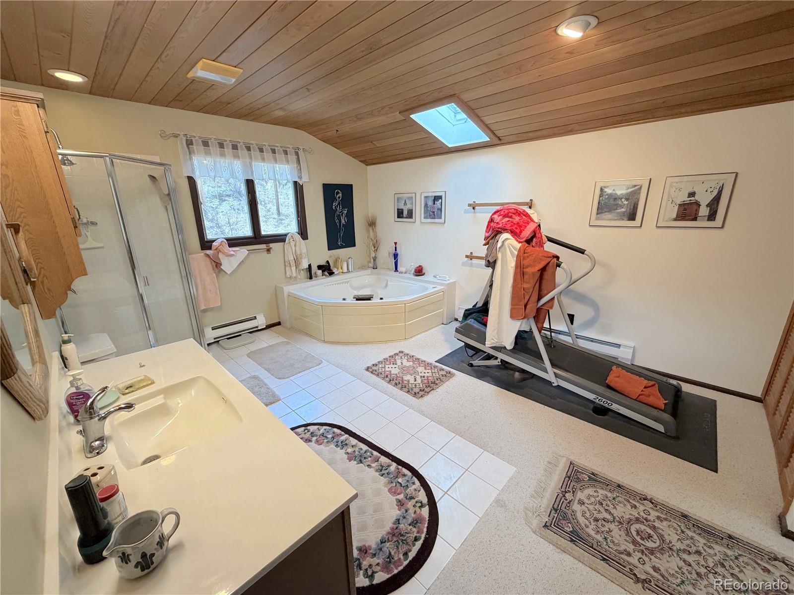 2508 Witter Gulch Road Evergreen, CO 80439 - Photo 39 of 47 a very nice looking room with many windows