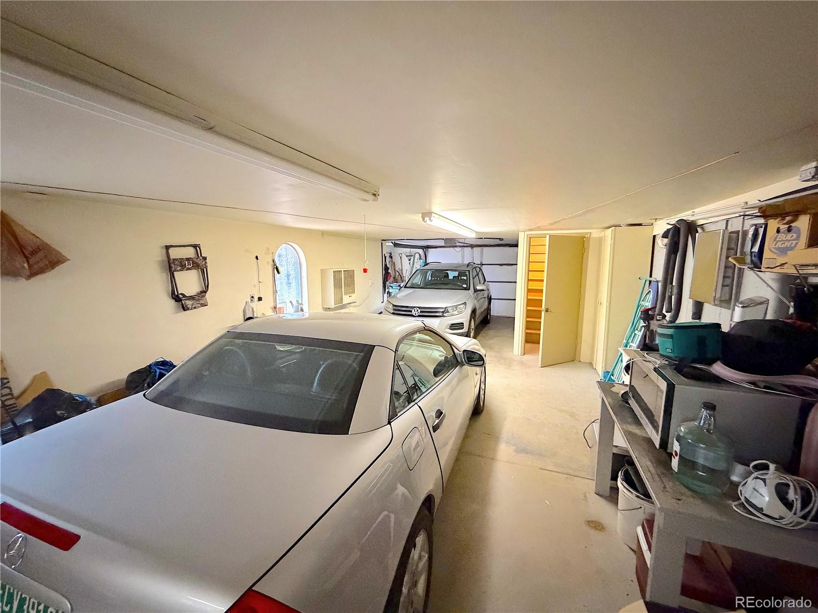 2508 Witter Gulch Road Evergreen, CO 80439 - Photo 45 of 47 a bed room with a bed and a chair