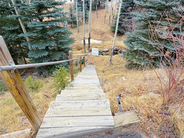 swimming pool view with a seating space