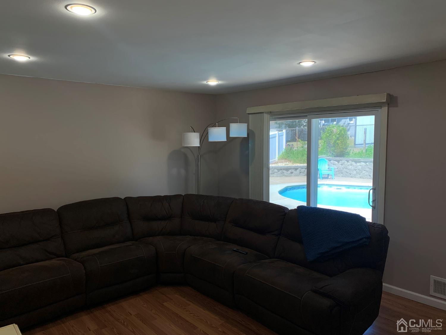 19 Columbia Road Old Bridge, NJ 08859 - Photo 12 of 24 a living room with a couch and a large window