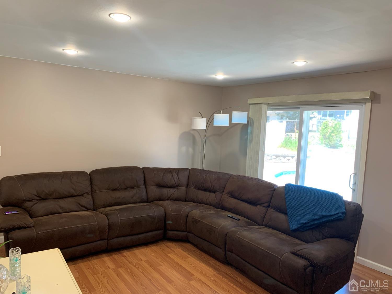 19 Columbia Road Old Bridge, NJ 08859 - Photo 13 of 24 a living room with furniture and a large window