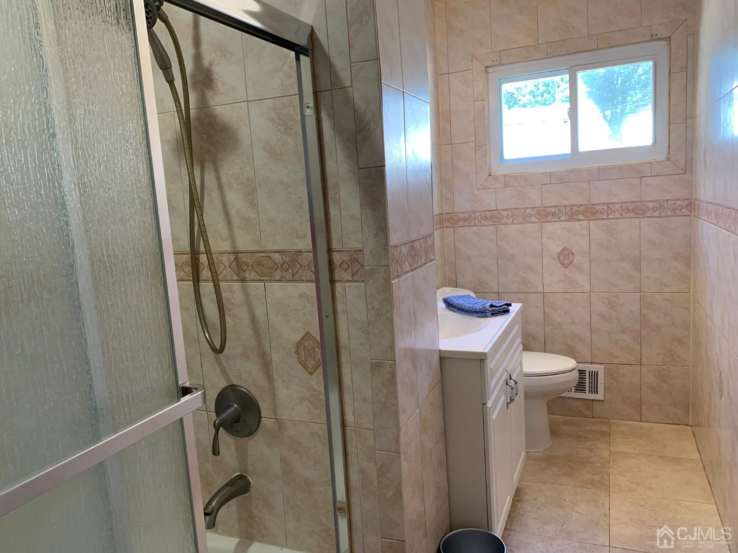19 Columbia Road Old Bridge, NJ 08859 - Photo 14 of 24 a bathroom with a toilet and a shower