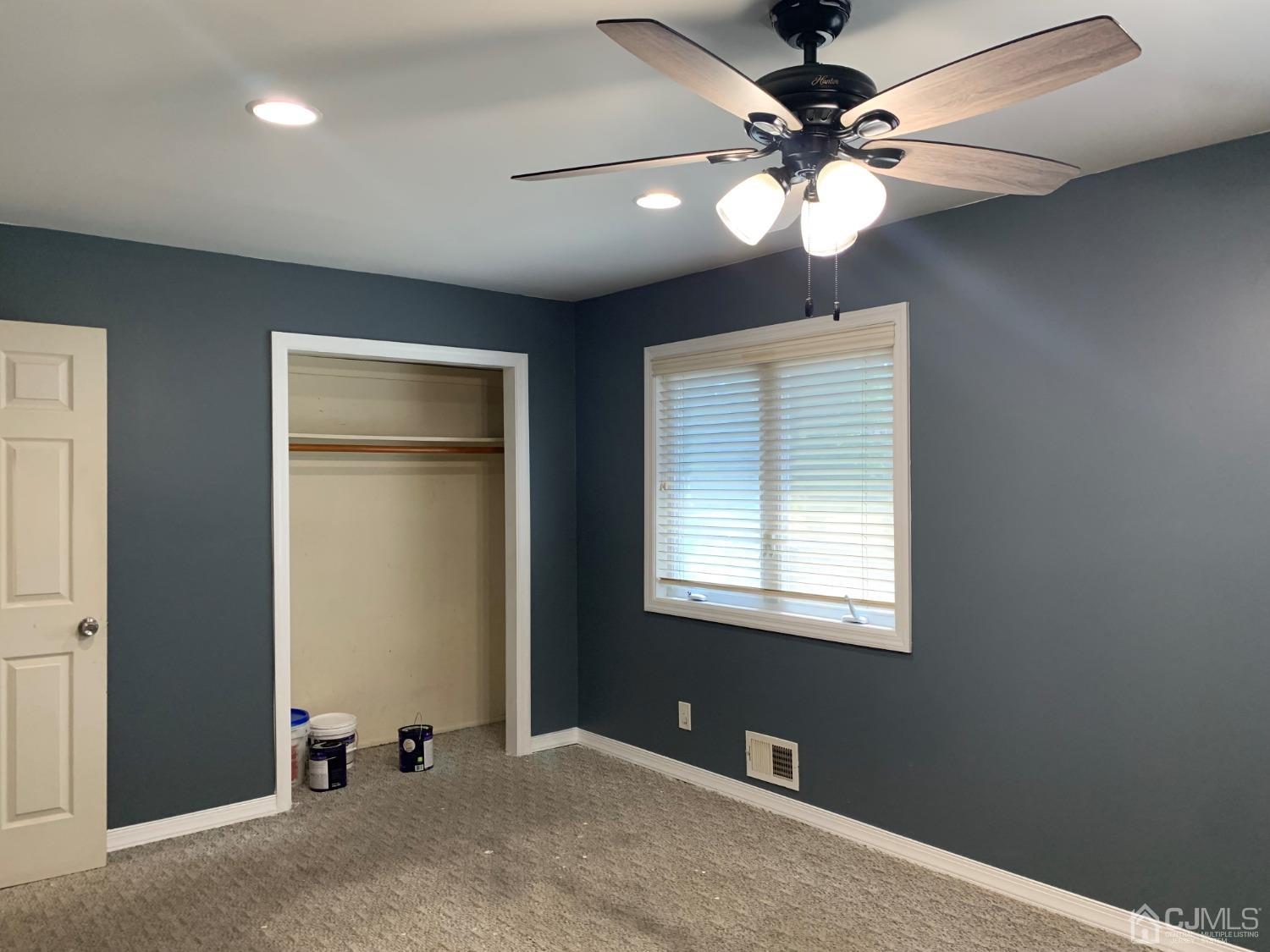 19 Columbia Road Old Bridge, NJ 08859 - Photo 18 of 24 a view of an empty room with window chandelier fan