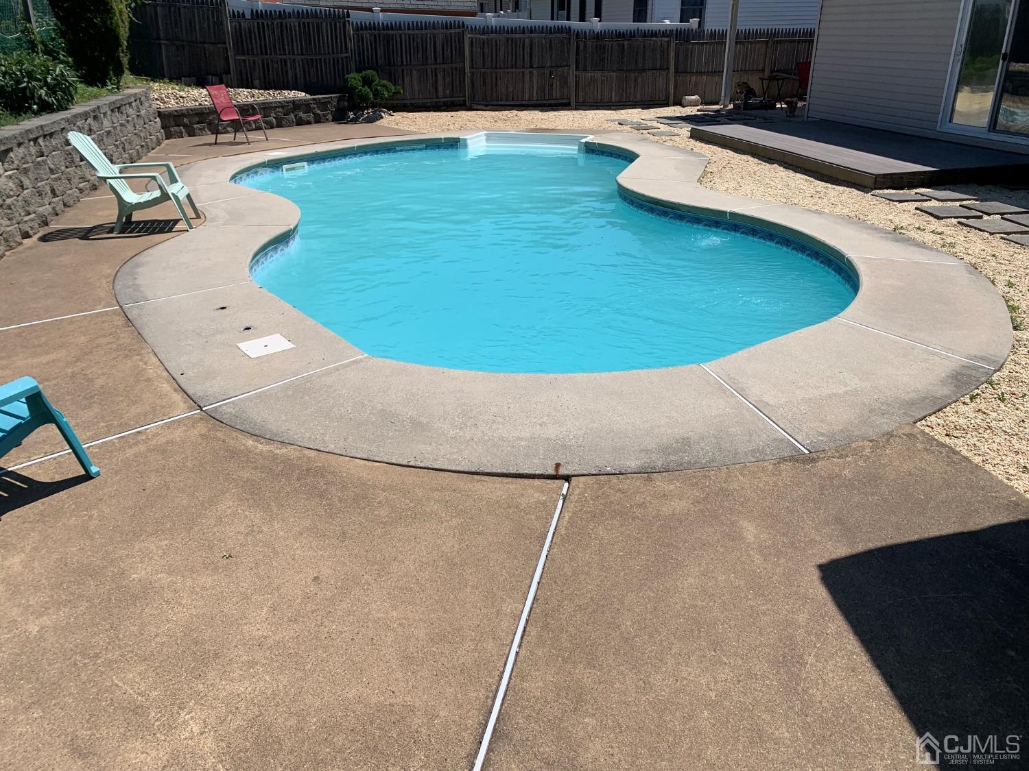 19 Columbia Road Old Bridge, NJ 08859 - Photo 24 of 24 a swimming pool with lawn chairs