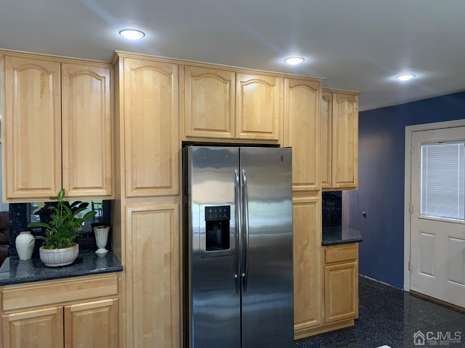 19 Columbia Road Old Bridge, NJ 08859 - Photo 6 of 24 a kitchen with stainless steel appliances granite countertop a refrigerator and a sink