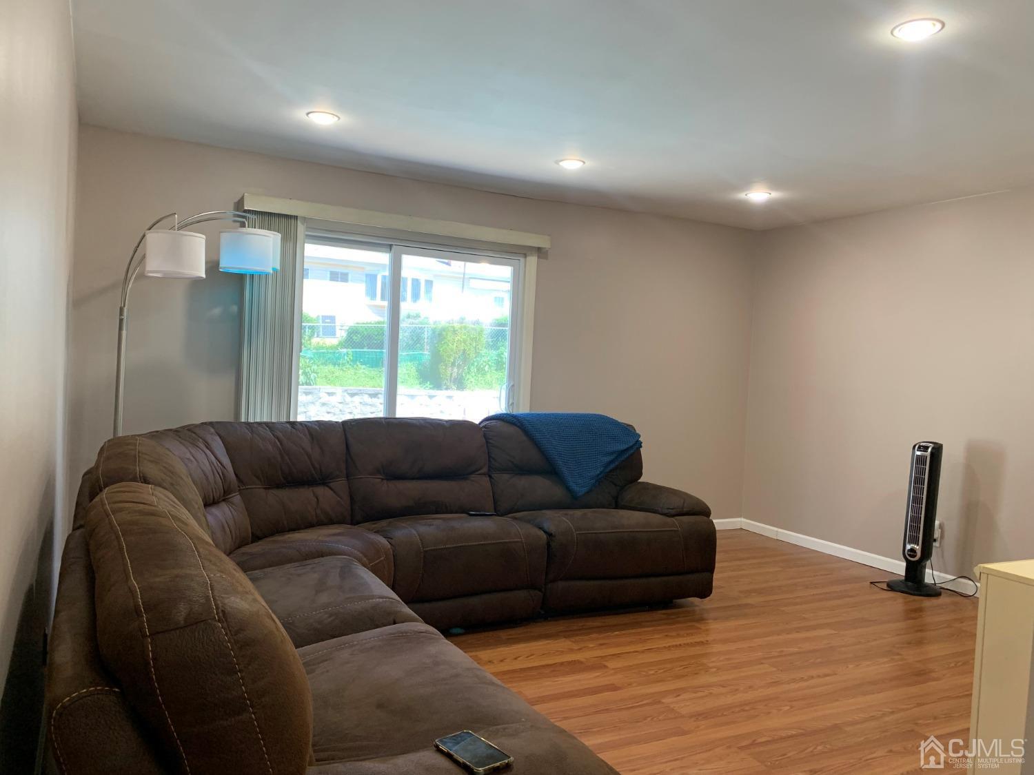 19 Columbia Road Old Bridge, NJ 08859 - Photo 10 of 24 a living room with furniture and a large window