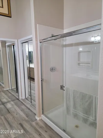 a bathroom with a glass shower door