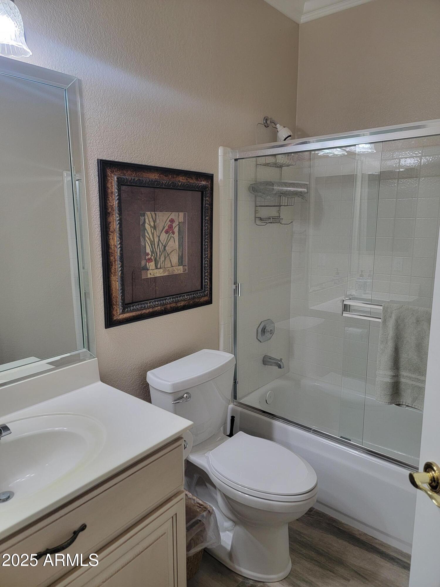 9757 East Tranquility Way Sun Lakes, AZ 85248 - Photo 10 of 10 a bathroom with a toilet sink and shower