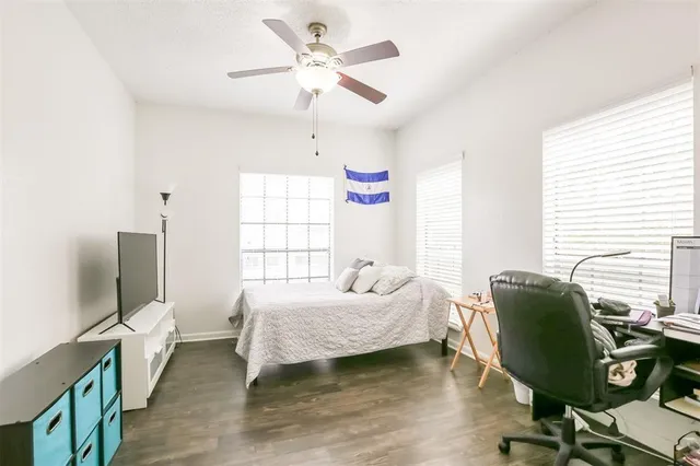 a bedroom with furniture and a window