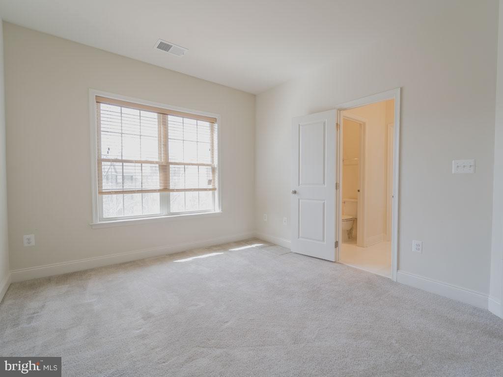22595 Windsor Locks Square Ashburn, VA 20148 - Photo 47 of 56 a view of an empty room with a window