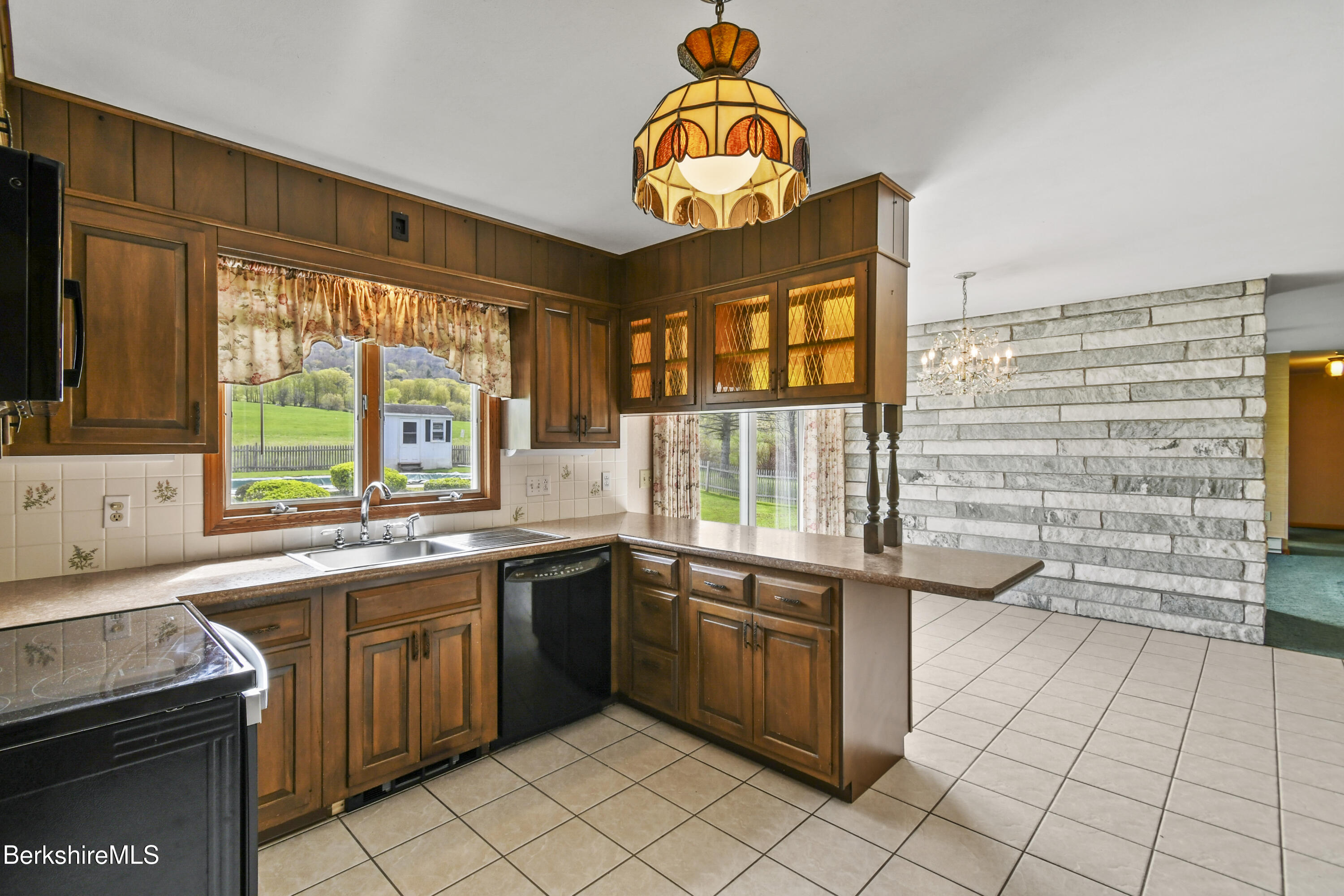 75 East Road Adams, MA 01220 - Photo 12 of 42 a kitchen with a sink a stove and cabinets