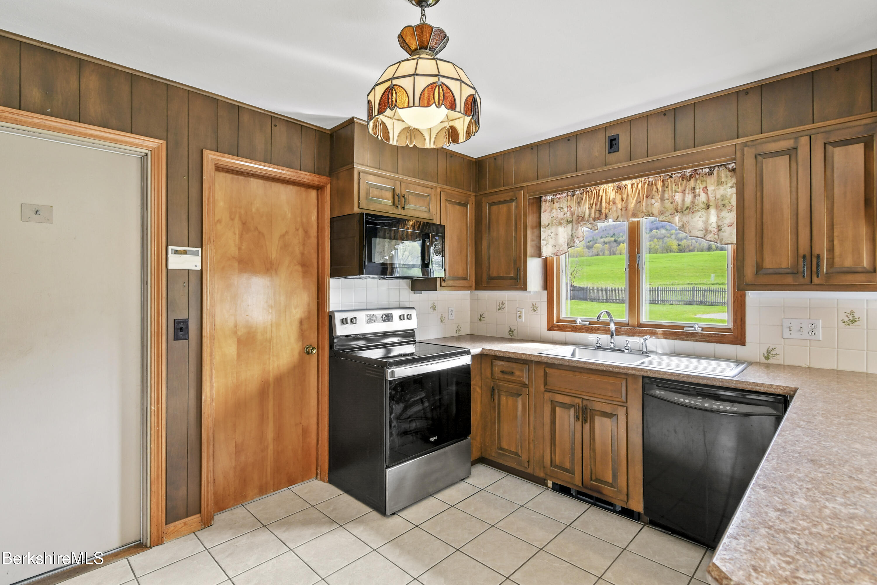 75 East Road Adams, MA 01220 - Photo 13 of 42 a kitchen with stainless steel appliances granite countertop a sink and a stove