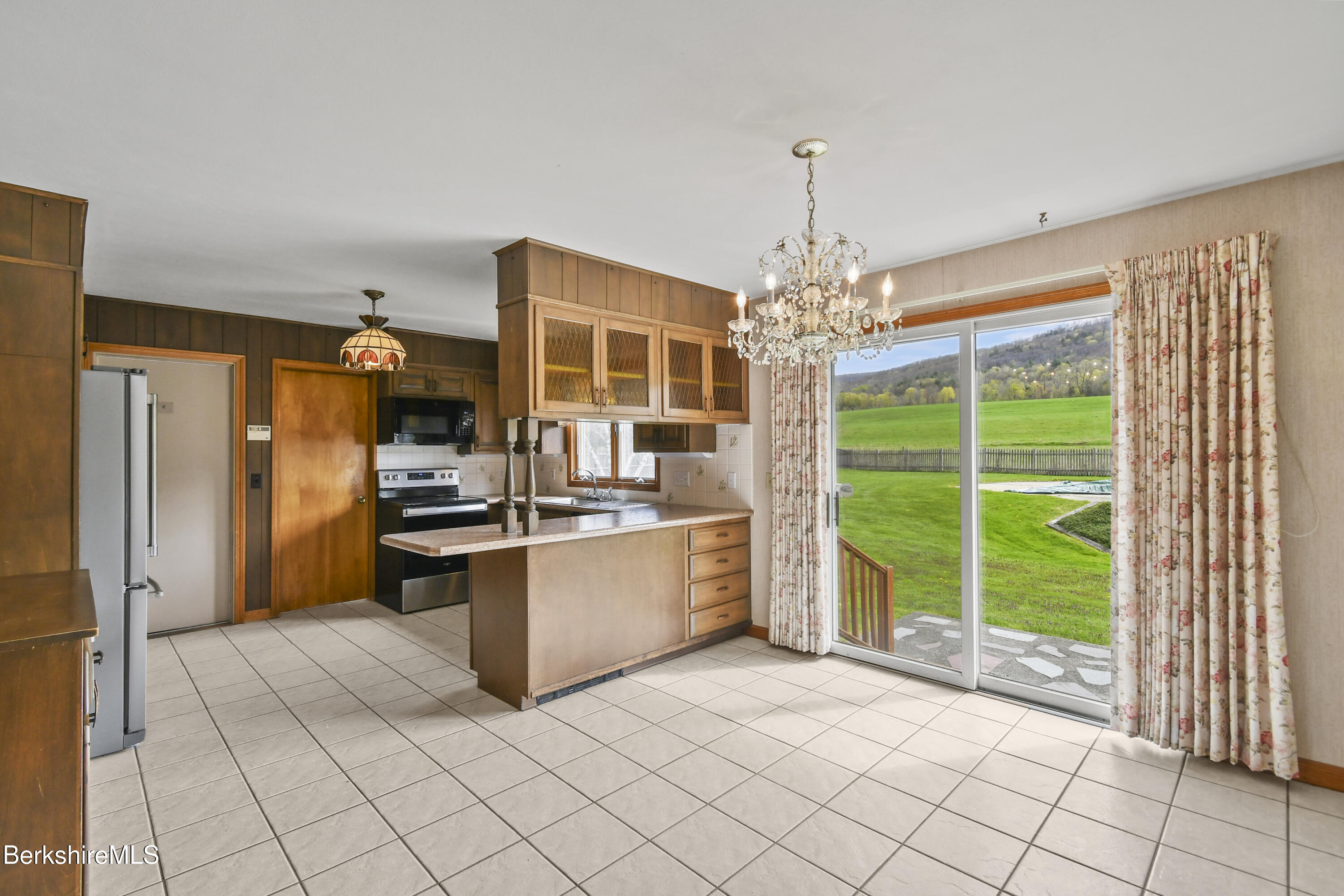 75 East Road Adams, MA 01220 - Photo 15 of 42 a kitchen with stainless steel appliances granite countertop a stove a sink and a refrigerator