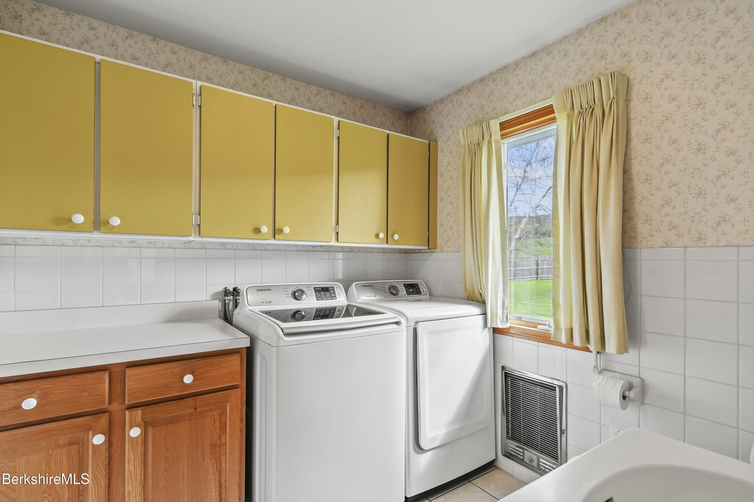 75 East Road Adams, MA 01220 - Photo 18 of 42 a utility room with stainless steel appliances granite countertop a sink a washer and dryer next to a window