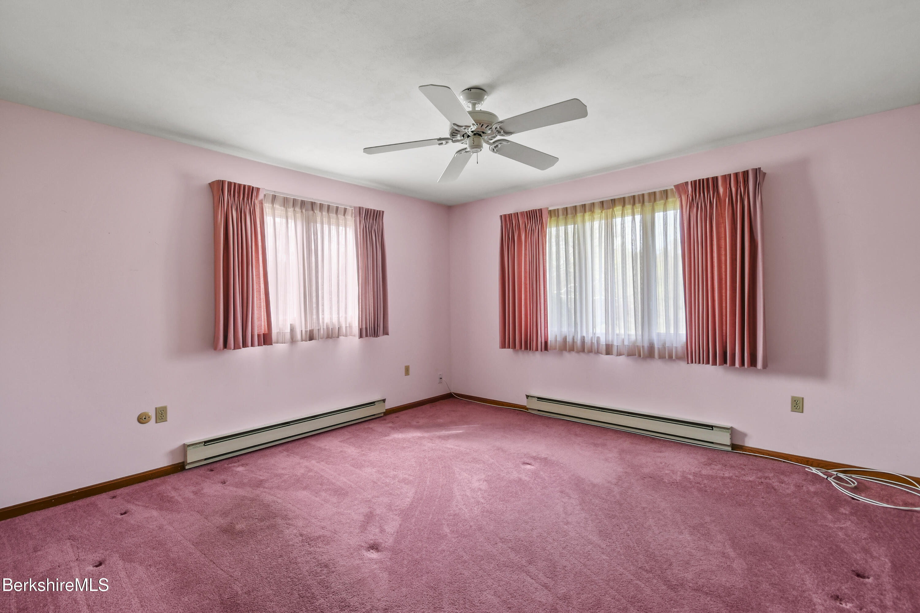 75 East Road Adams, MA 01220 - Photo 30 of 42 an empty room with windows and fan