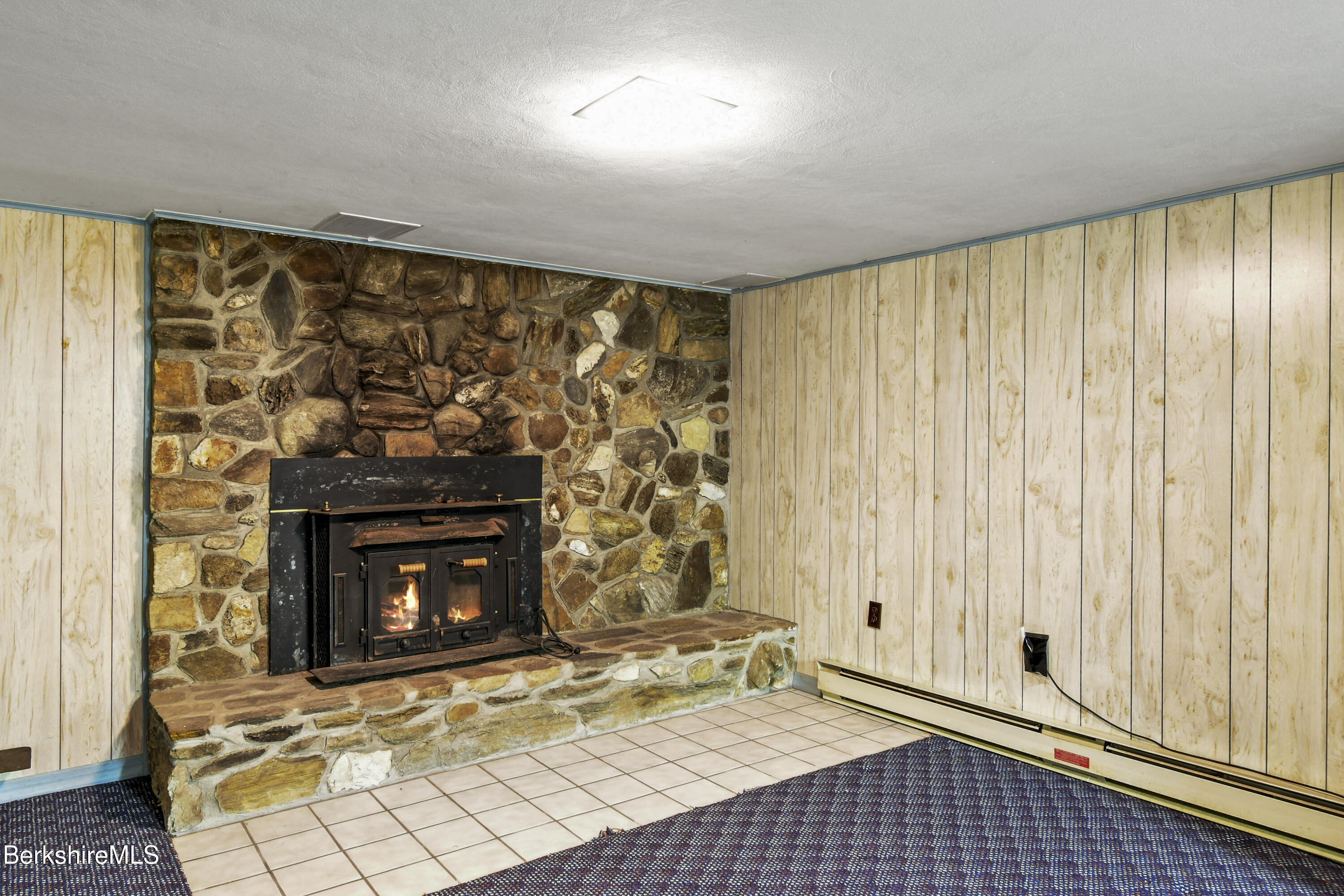 75 East Road Adams, MA 01220 - Photo 33 of 42 a living room with a fireplace