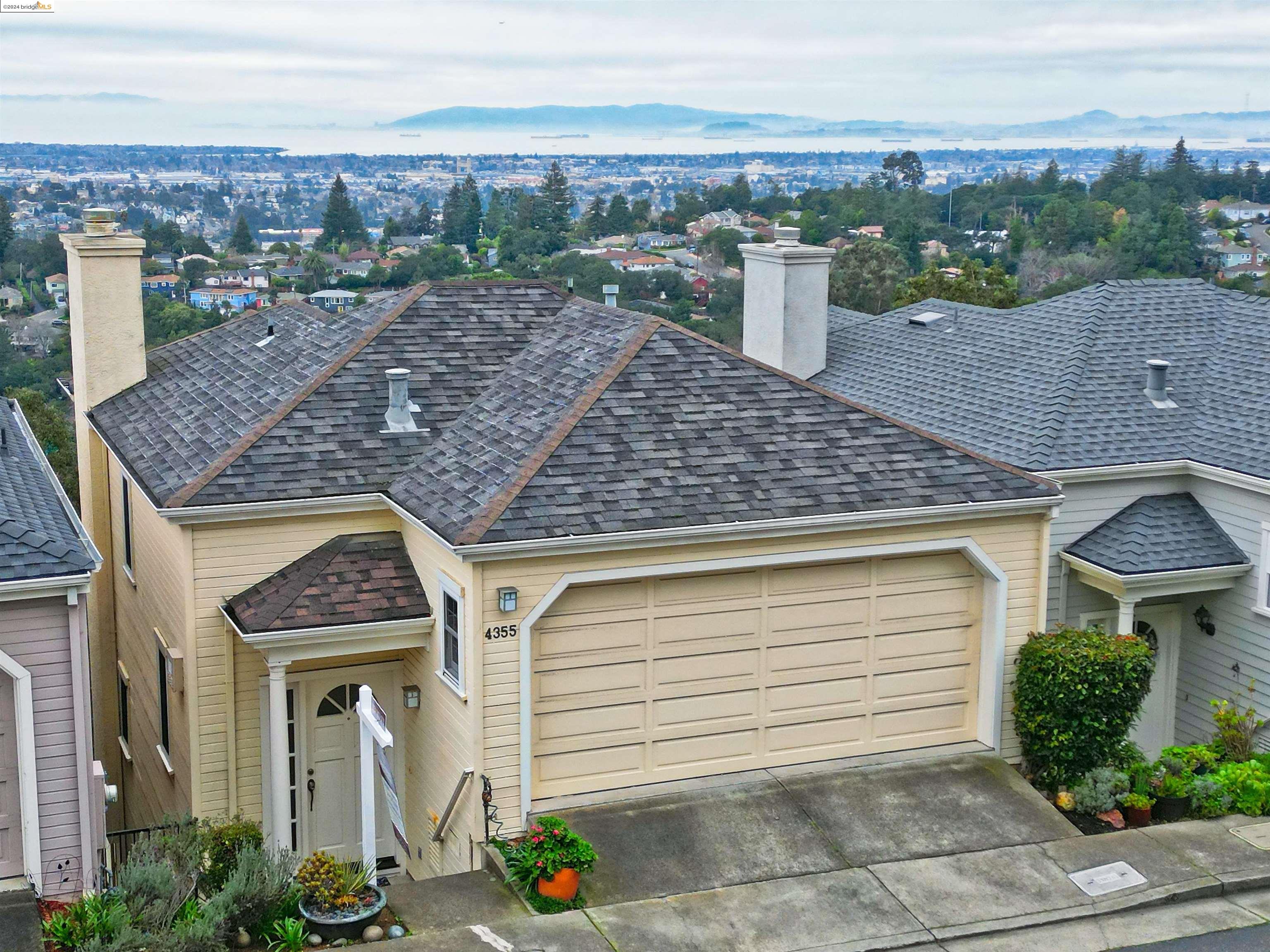 a view of a brick house with a large windows
