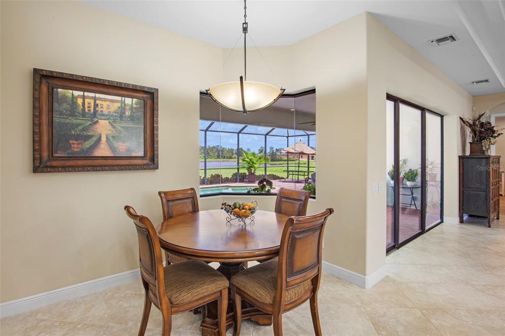 3511 Twin Rivers Trail Parrish, FL 34219 - Photo 15 of 43 a view of a dining room with furniture window and outside view