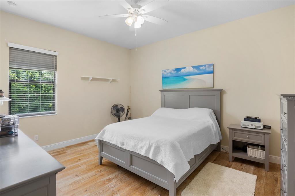 3511 Twin Rivers Trail Parrish, FL 34219 - Photo 19 of 43 a bedroom with a bed and a window