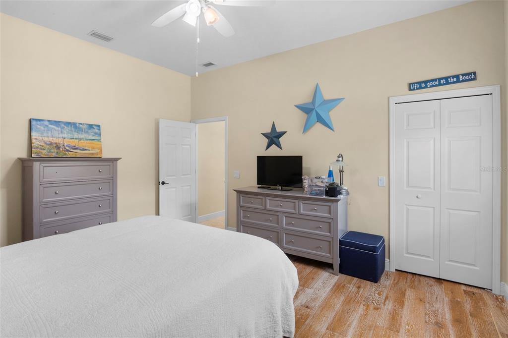3511 Twin Rivers Trail Parrish, FL 34219 - Photo 20 of 43 a bedroom with a bed and a television