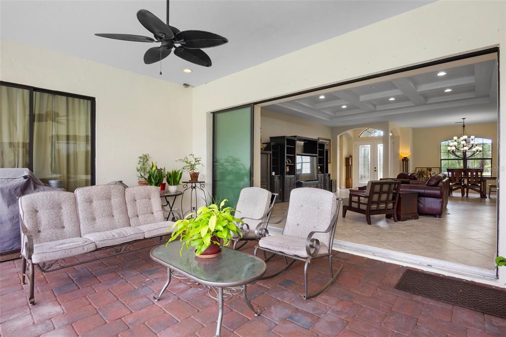 3511 Twin Rivers Trail Parrish, FL 34219 - Photo 34 of 43 a living room with furniture and a large window