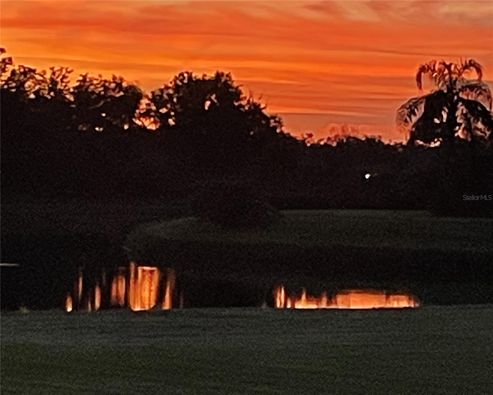 3511 Twin Rivers Trail Parrish, FL 34219 - Photo 43 of 43 a sunset view with a swimming pool