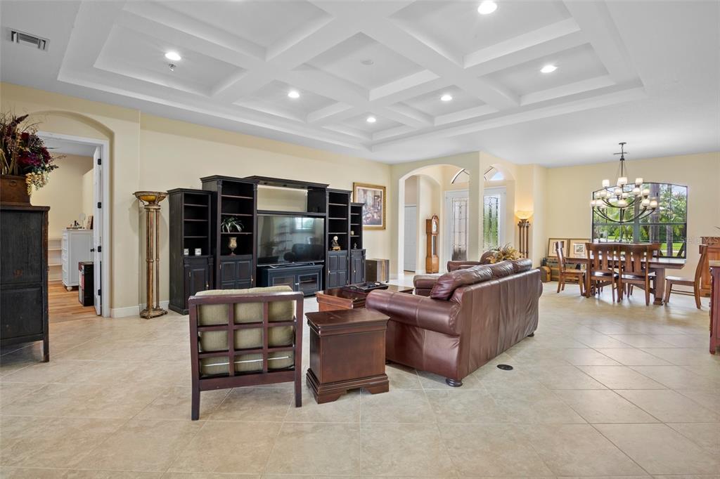 3511 Twin Rivers Trail Parrish, FL 34219 - Photo 8 of 43 a living room with furniture and a chandelier