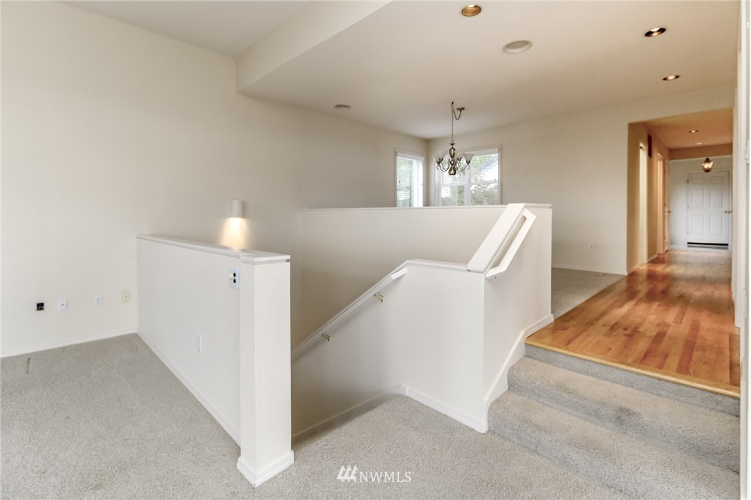 152 Cormorant Drive Steilacoom, WA 98388 - Photo 11 of 40 a view of a livingroom with furniture wooden floor and windows