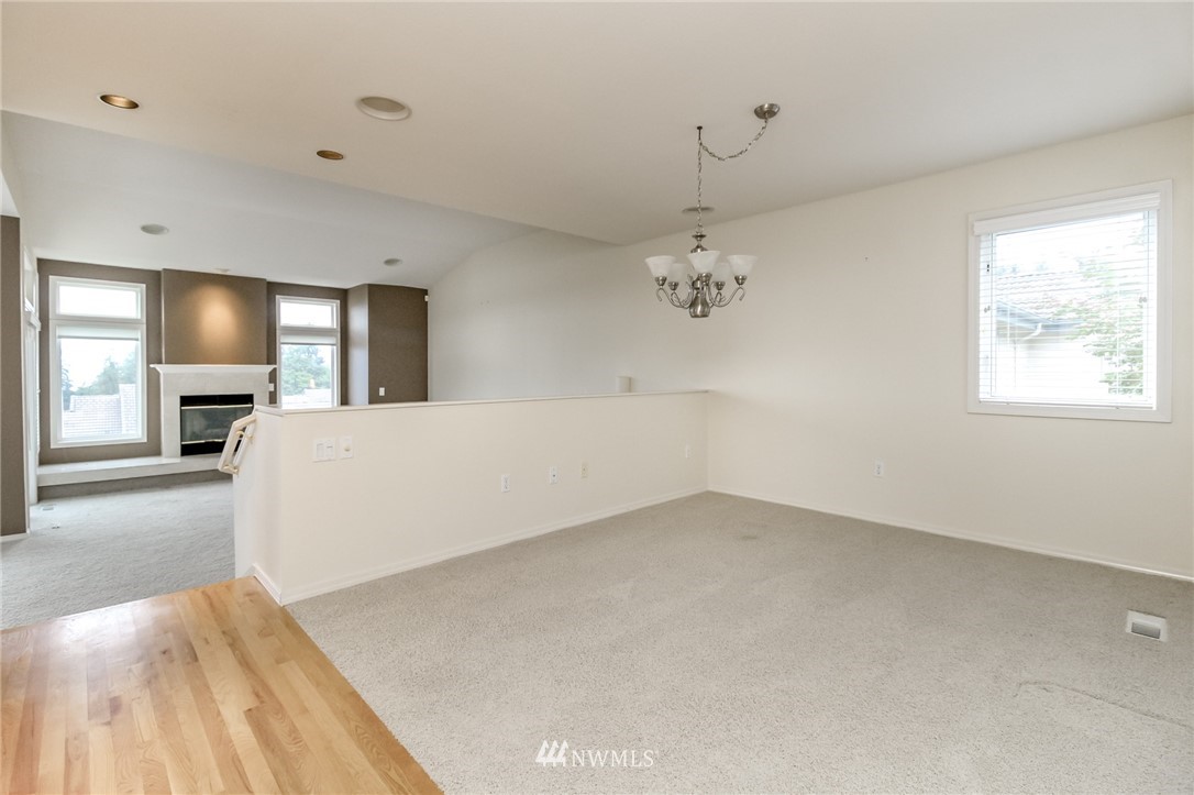152 Cormorant Drive Steilacoom, WA 98388 - Photo 12 of 40 a view of empty room with window and fireplace