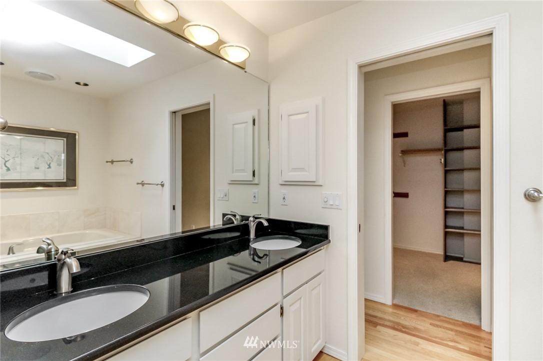 152 Cormorant Drive Steilacoom, WA 98388 - Photo 28 of 40 a bathroom with a sink and a mirror