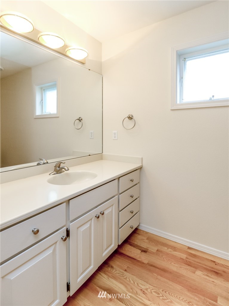 152 Cormorant Drive Steilacoom, WA 98388 - Photo 31 of 40 a bathroom with a sink and a mirror