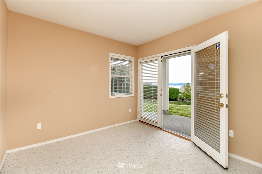 152 Cormorant Drive Steilacoom, WA 98388 - Photo 37 of 40 a view of an empty room with glass door