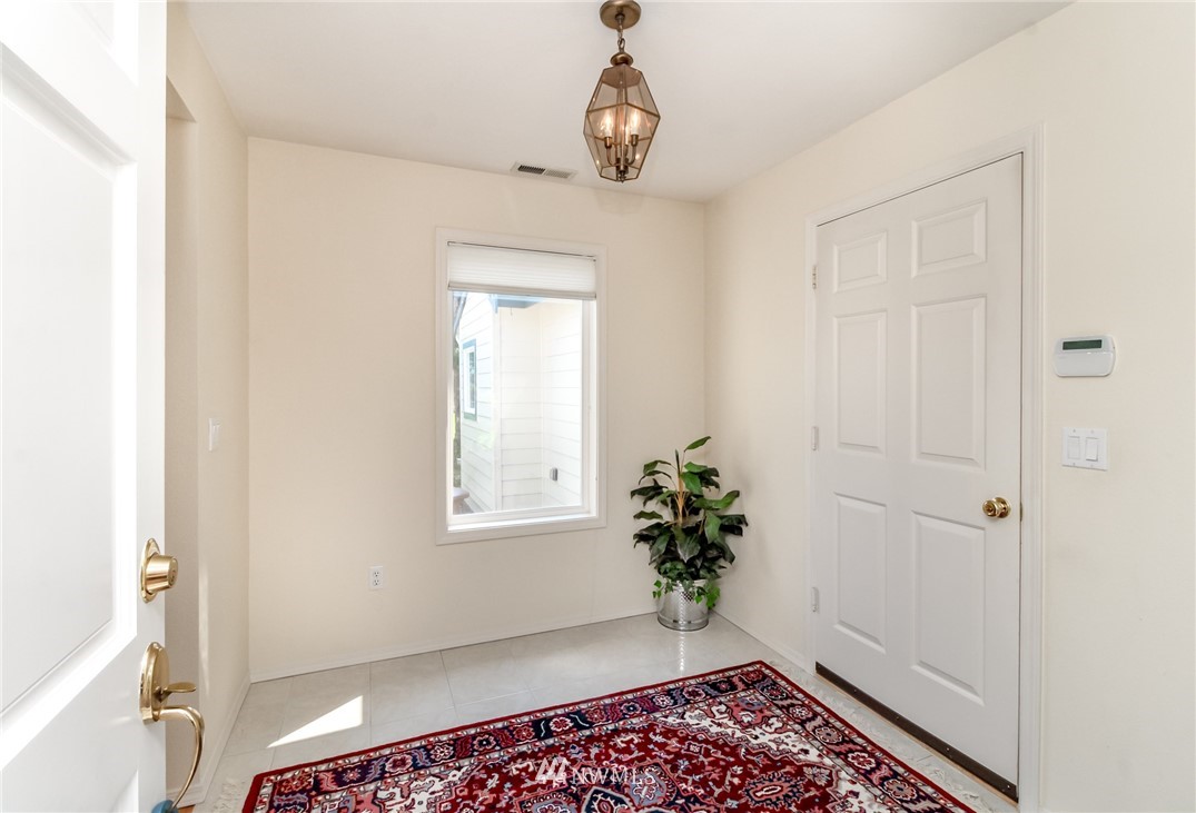 152 Cormorant Drive Steilacoom, WA 98388 - Photo 9 of 40 a view of an entryway with wooden floor