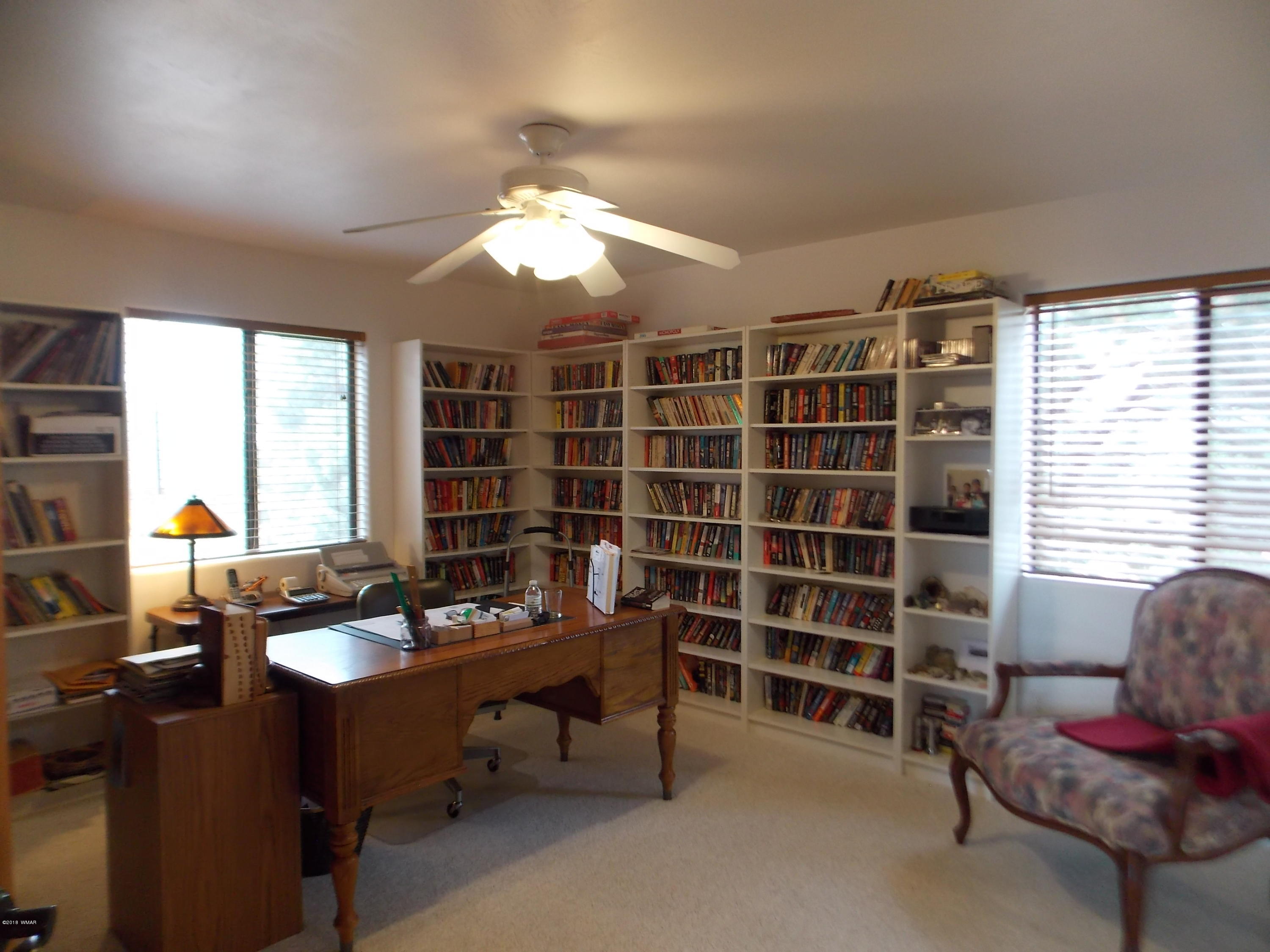 2296 Sunrise Road Overgaard, AZ 85933 - Photo 11 of 66 a reading room with furniture and a window